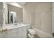 Bright bathroom featuring a white vanity, large mirror, and a shower-tub combination at 115 Golfview Ln, Summerville, SC 29485
