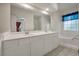 Bright bathroom features dual sink vanity, soaking tub and a large window at 115 Golfview Ln, Summerville, SC 29485