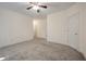 Carpeted bedroom features a ceiling fan and two doors with easy access at 115 Golfview Ln, Summerville, SC 29485