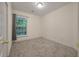 Cozy carpeted bedroom with a large window offering natural light at 115 Golfview Ln, Summerville, SC 29485