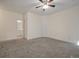 Comfortable carpeted bedroom with ceiling fan; bathroom access is visible at 115 Golfview Ln, Summerville, SC 29485