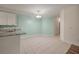 Open dining area boasts tile floors, chair rail molding, and a modern light fixture at 115 Golfview Ln, Summerville, SC 29485