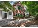 Condo exterior with well-maintained landscaping, brick accents, and mature trees at 115 Golfview Ln, Summerville, SC 29485