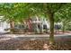 Back exterior of condo unit featuring a screened patio and balcony at 115 Golfview Ln, Summerville, SC 29485