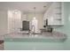 Bright kitchen featuring granite countertops, modern appliances, and a breakfast bar at 115 Golfview Ln, Summerville, SC 29485