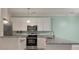 Kitchen with white cabinets, stainless appliances, and granite countertops at 115 Golfview Ln, Summerville, SC 29485