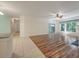Bright living room featuring hardwood floors, fireplace, and sliding glass door to the outside at 115 Golfview Ln, Summerville, SC 29485