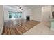 Inviting living room showcasing a fireplace, large windows and new hardwood style flooring at 115 Golfview Ln, Summerville, SC 29485