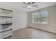 This bedroom has a ceiling fan and a large window with a backyard view at 117 Macy Cir, Goose Creek, SC 29445