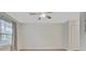 Neutral bedroom with luxury vinyl flooring, large window, and ceiling fan at 117 Macy Cir, Goose Creek, SC 29445