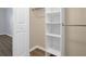 Organized walk-in closet with built-in shelves and rods for efficient storage solutions at 117 Macy Cir, Goose Creek, SC 29445