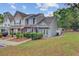 Charming two-story townhome with well-maintained landscaping and inviting front entrance at 117 Macy Cir, Goose Creek, SC 29445