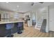 Open concept kitchen with stainless steel appliances, granite countertops, and access to the stairway at 117 Macy Cir, Goose Creek, SC 29445