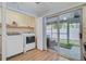 Laundry room featuring a washer and dryer, storage shelving, and sliding glass doors to the back at 117 Macy Cir, Goose Creek, SC 29445