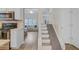 View of a kitchen, stairs, and a living room with natural light and comfortable seating at 117 Macy Cir, Goose Creek, SC 29445