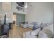Bright living room with wood floors, vaulted ceiling, and a comfortable sectional sofa at 117 Macy Cir, Goose Creek, SC 29445