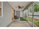 Cozy sunroom with screen windows, ceiling fan, and sliding door to backyard at 117 Macy Cir, Goose Creek, SC 29445