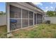 Exterior view of a sunroom with screen windows, access to the backyard, and ceiling fan at 117 Macy Cir, Goose Creek, SC 29445