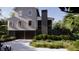 Charming two-story home featuring a two-car garage, dark trim and a well-manicured lawn at 117 Spartina Ct, Kiawah Island, SC 29455