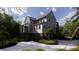 Stylish two-story house featuring a staircase and front porch, complemented by landscaped yard at 117 Spartina Ct, Kiawah Island, SC 29455
