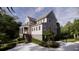 Sophisticated two-story house with a covered porch and manicured landscaping, creating a serene appeal at 117 Spartina Ct, Kiawah Island, SC 29455