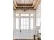 Beautiful front entry featuring a transom window, chandelier, and natural light at 117 Spartina Ct, Kiawah Island, SC 29455
