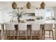 Bright kitchen with large island, pendant lighting and modern countertops at 117 Spartina Ct, Kiawah Island, SC 29455