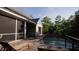Inviting backyard pool with lounge chairs, seamlessly integrated into the deck and porch area at 117 Spartina Ct, Kiawah Island, SC 29455