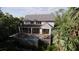 Beautiful two-story home with a serene backyard featuring a pool, deck, and a surrounding forest at 117 Spartina Ct, Kiawah Island, SC 29455