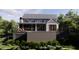 Rear exterior view of a beautiful two-story home with a pool and a spacious outdoor deck at 117 Spartina Ct, Kiawah Island, SC 29455