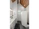 Bright bathroom with double vanity, shiplap walls, a window, and walk-in shower with brick-style tile at 1179 Holly Bend Dr, Mount Pleasant, SC 29466