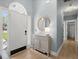Inviting entryway with light blue walls, wood floors, bright natural light, and attractive decor at 1179 Holly Bend Dr, Mount Pleasant, SC 29466