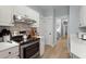 Kitchen featuring stainless steel appliances, sleek countertops, and white cabinetry at 1179 Holly Bend Dr, Mount Pleasant, SC 29466