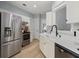 Bright kitchen with stainless steel appliances, white cabinets and countertops, and modern fixtures at 1179 Holly Bend Dr, Mount Pleasant, SC 29466