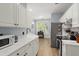 Well-lit kitchen featuring ample counter space, modern appliances, and stylish white cabinets at 1179 Holly Bend Dr, Mount Pleasant, SC 29466