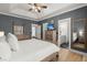 Spacious main bedroom features a ceiling fan, wood flooring, ensuite bathroom, and large dressers at 1179 Holly Bend Dr, Mount Pleasant, SC 29466
