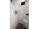 Close-up of brick-style tile in walk-in shower featuring built-in seat and decorative accent at 1179 Holly Bend Dr, Mount Pleasant, SC 29466