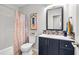 Bathroom featuring a toilet, vanity with a dark cabinet, shower with tub, and modern fixtures at 1227 Ocean View Rd, Charleston, SC 29412