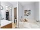 Relaxing bathroom featuring a soaking tub, walk-in closet, and neutral tones for a spa-like atmosphere at 1227 Ocean View Rd, Charleston, SC 29412