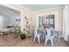 Cozy dining area featuring a farmhouse-style table, chairs, and abundant natural light from a sliding door at 1227 Ocean View Rd, Charleston, SC 29412
