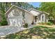 Charming single-Gathering home with attached garage and a well-maintained front yard at 1227 Ocean View Rd, Charleston, SC 29412