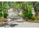 Beautiful home with a long driveway, lush greenery, and mature trees in the yard at 1227 Ocean View Rd, Charleston, SC 29412