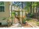 Backyard greenhouse with a variety of plants, brick flooring, and natural light at 1227 Ocean View Rd, Charleston, SC 29412