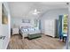 Serene main bedroom with vaulted ceiling, light blue walls, and ample natural light at 1227 Ocean View Rd, Charleston, SC 29412
