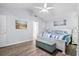Bright main bedroom featuring a ceiling fan, a king-sized bed and an ensuite bathroom at 1227 Ocean View Rd, Charleston, SC 29412