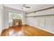 Bedroom boasts hardwood floors, a charming roll-top desk, and built-in shelving at 123 Azalea Dr, Summerville, SC 29485