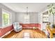 Charming dining room with hardwood floors, chair rail, and a modern chandelier at 123 Azalea Dr, Summerville, SC 29485
