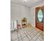 The tiled entryway features a beautiful wooden door and charming decorative accents at 123 Azalea Dr, Summerville, SC 29485