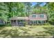 Charming brick home with lush green lawn and mature trees offers inviting curb appeal at 123 Azalea Dr, Summerville, SC 29485