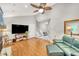 Spacious living room with hardwood floors, ceiling fan, and staircase at 123 Azalea Dr, Summerville, SC 29485